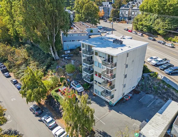 an aerial view of a house with a yard