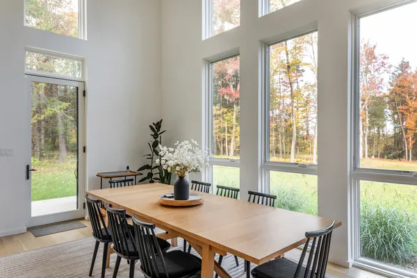 a view of a dining room with furniture window and outside view