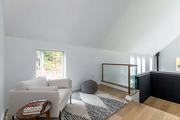 a bedroom with furniture and a window