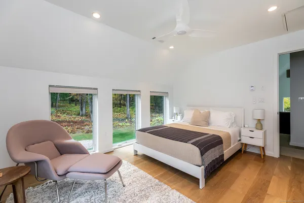 a bedroom with a bed and a couch