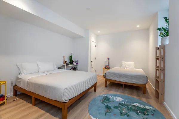 a bedroom with a bed and a couch