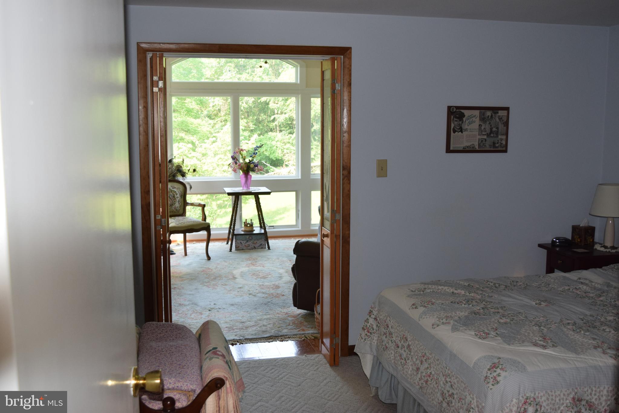 14642 Orchard Ridge Road Hancock, MD 21750 - Photo 23 of 43 Bedroom also leads to a sun room