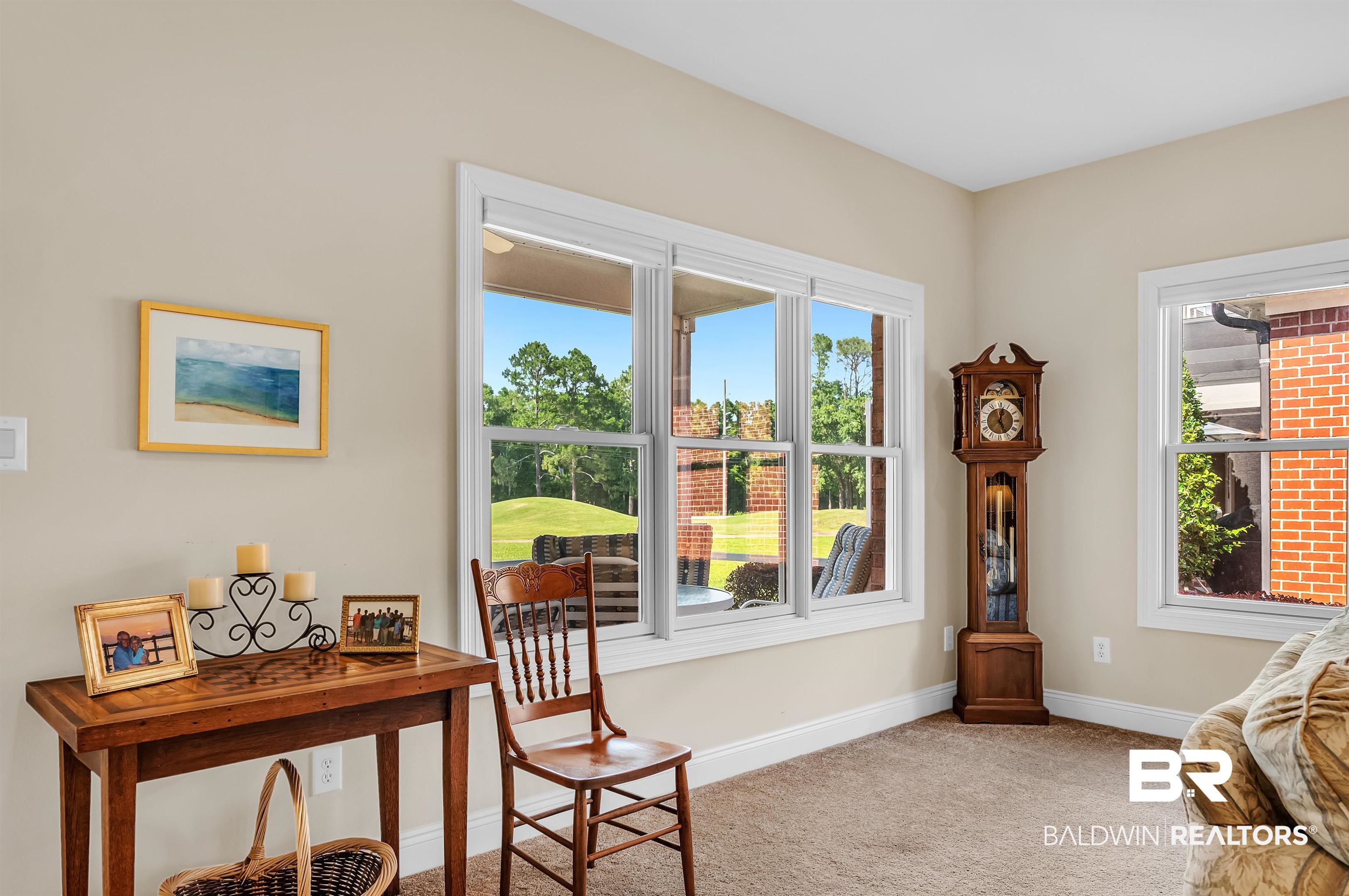 22739 Inverness Way Foley, AL 36535 - Photo 24 of 80 Living area featuring light carpet, plenty of natural light, and baseboards