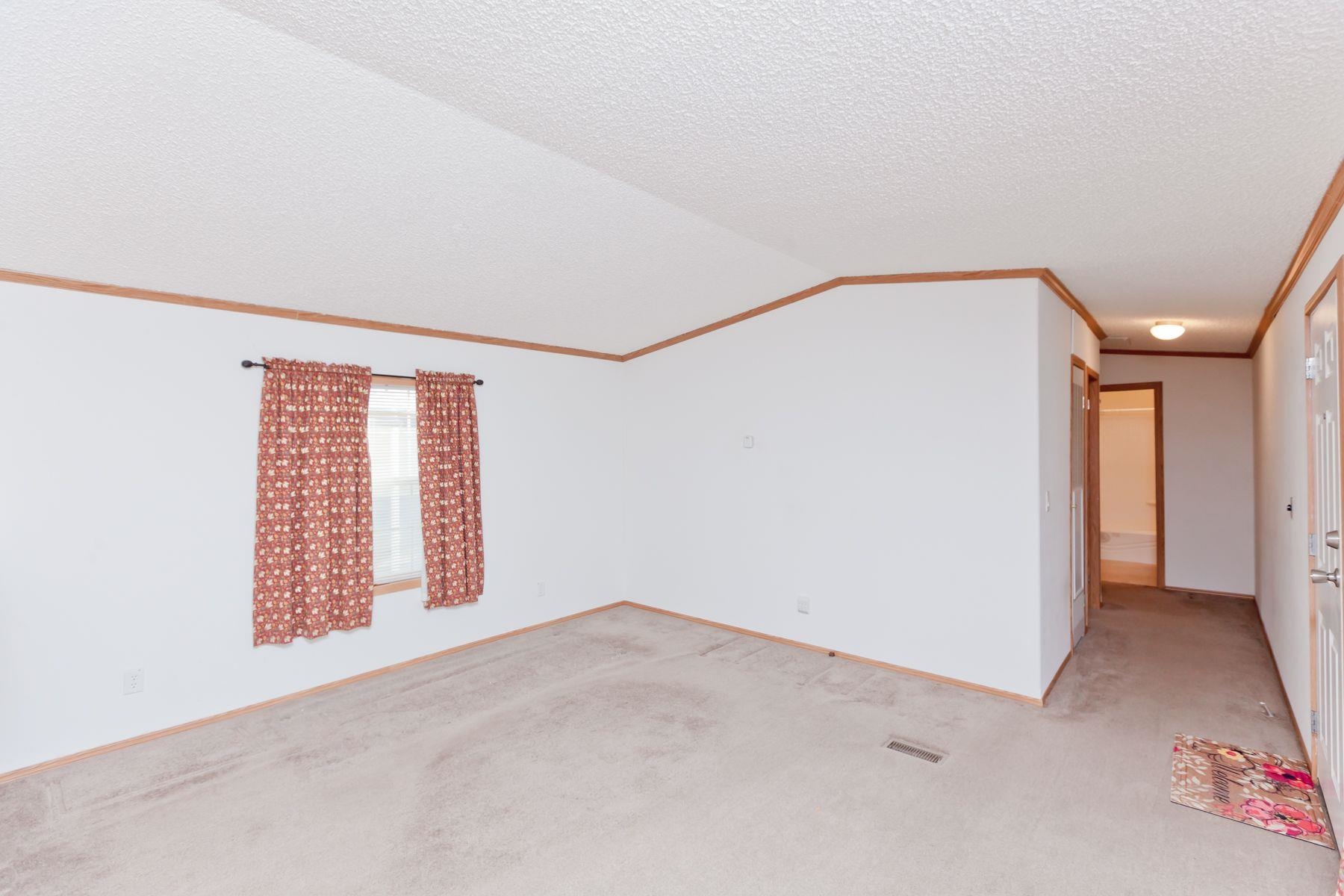 435 32 Road, Unit 232 Clifton, CO 81520 - Photo 12 of 37 a view of an empty room with a window