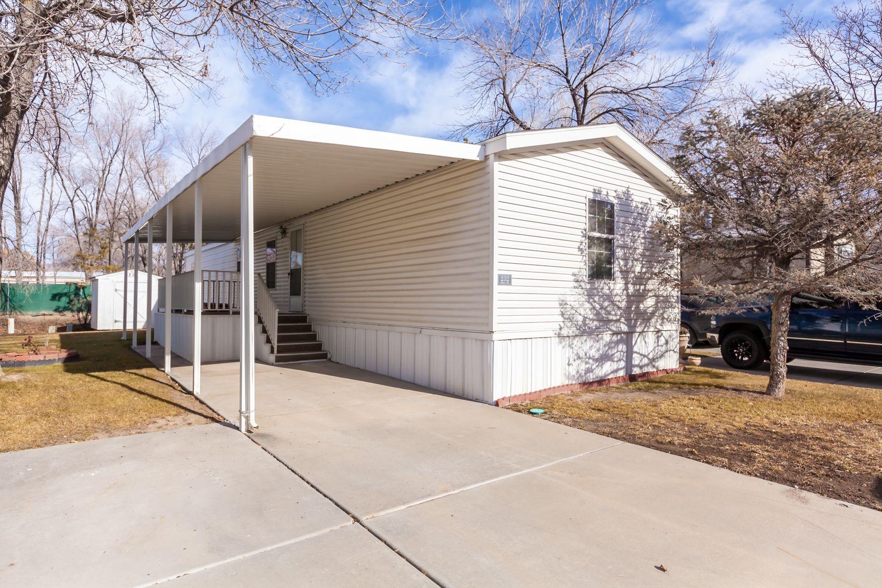 435 32 Road, Unit 232 Clifton, CO 81520 - Photo 2 of 37 a backyard of a house with large trees