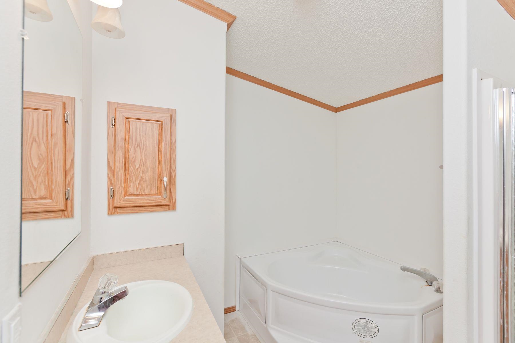 435 32 Road, Unit 232 Clifton, CO 81520 - Photo 23 of 37 a bathroom with a sink and a mirror