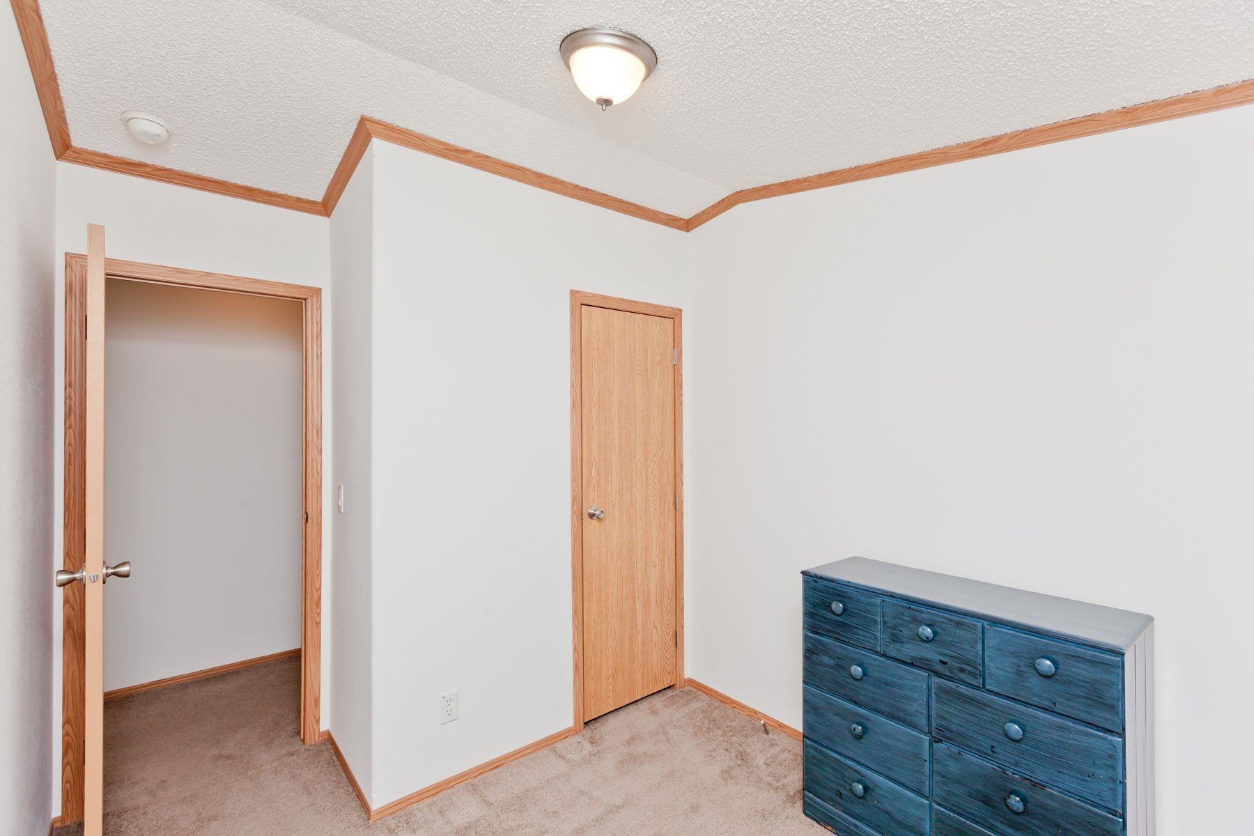 435 32 Road, Unit 232 Clifton, CO 81520 - Photo 27 of 37 a view of room with closet and wooden floor