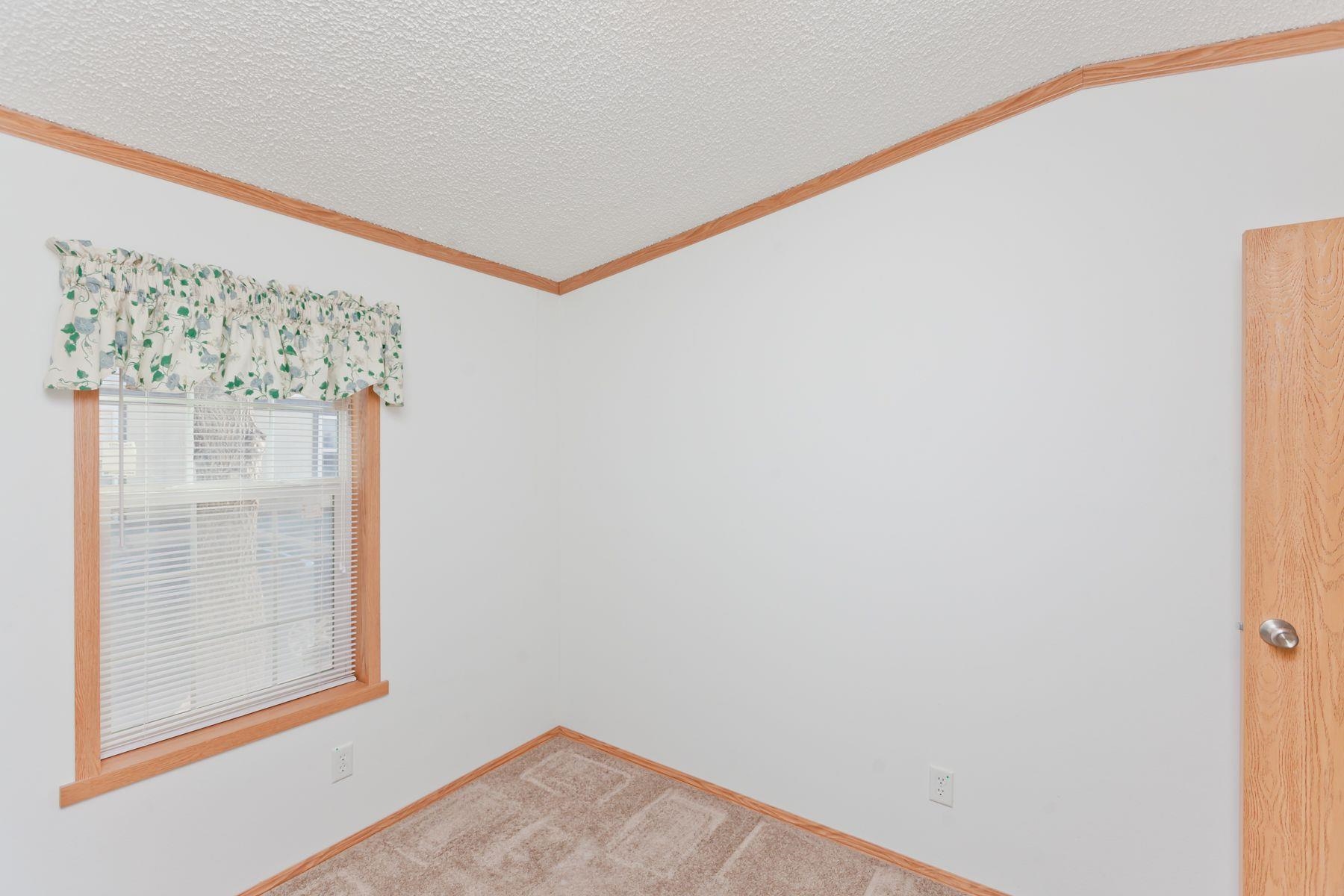 435 32 Road, Unit 232 Clifton, CO 81520 - Photo 29 of 37 a view of a small space with wooden floor and a window
