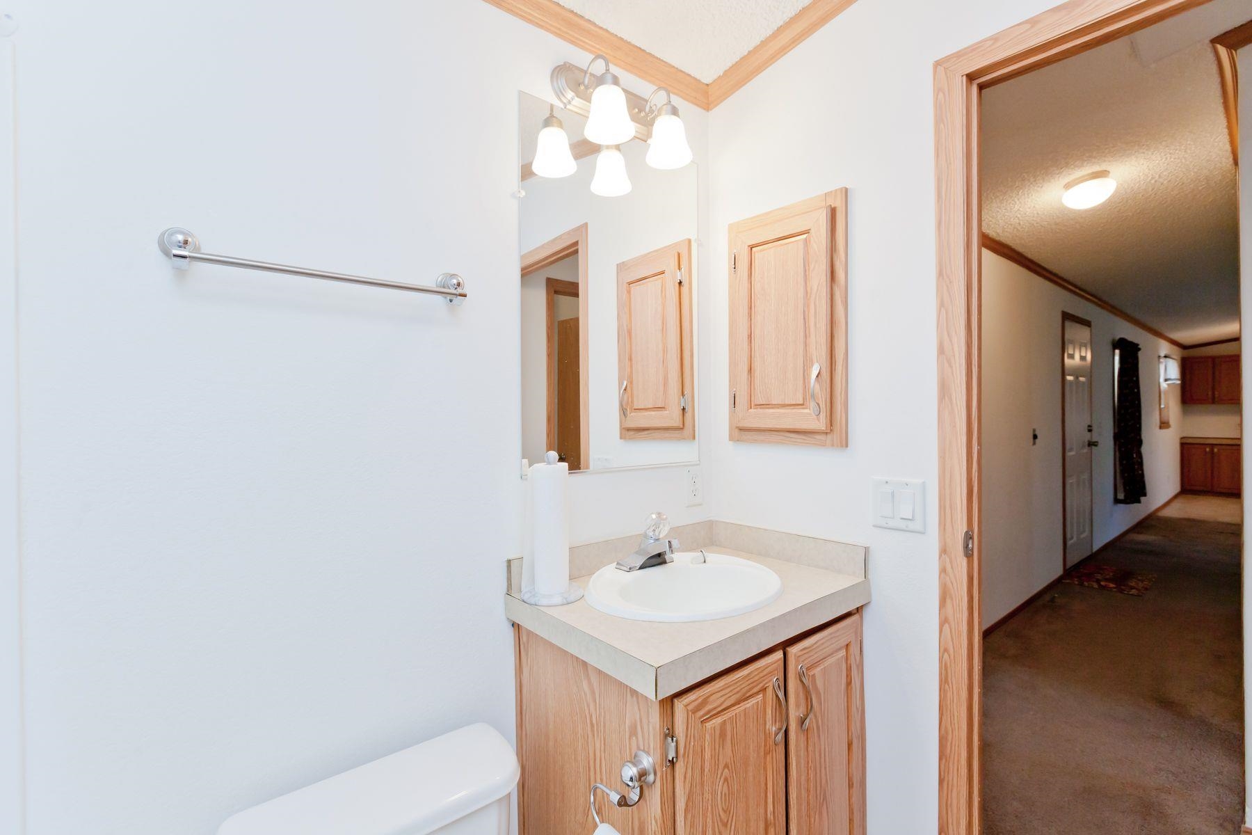 435 32 Road, Unit 232 Clifton, CO 81520 - Photo 31 of 37 a bathroom with a sink vanity mirror and shower
