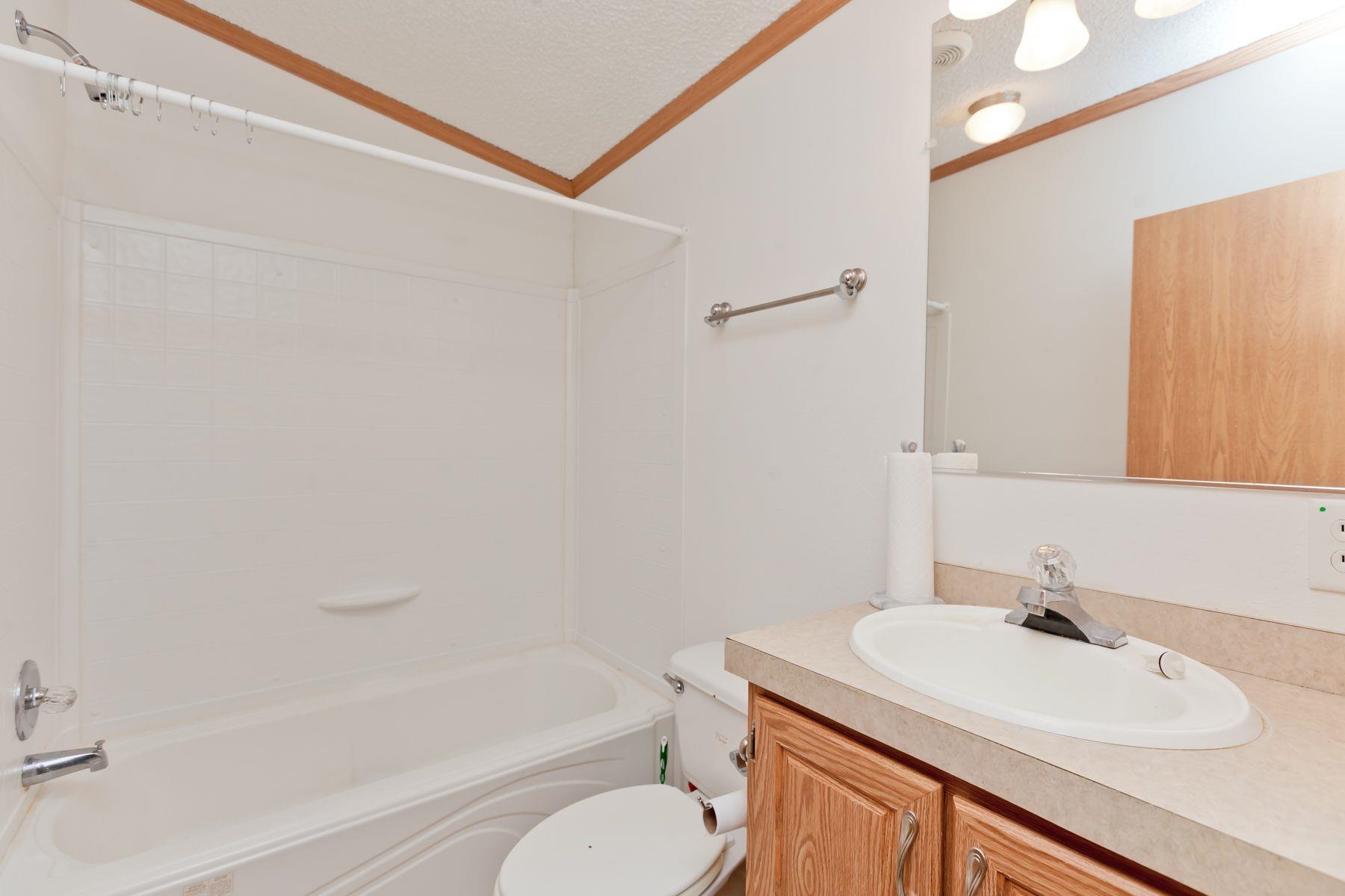 435 32 Road, Unit 232 Clifton, CO 81520 - Photo 32 of 37 a bathroom with a sink toilet vanity and shower