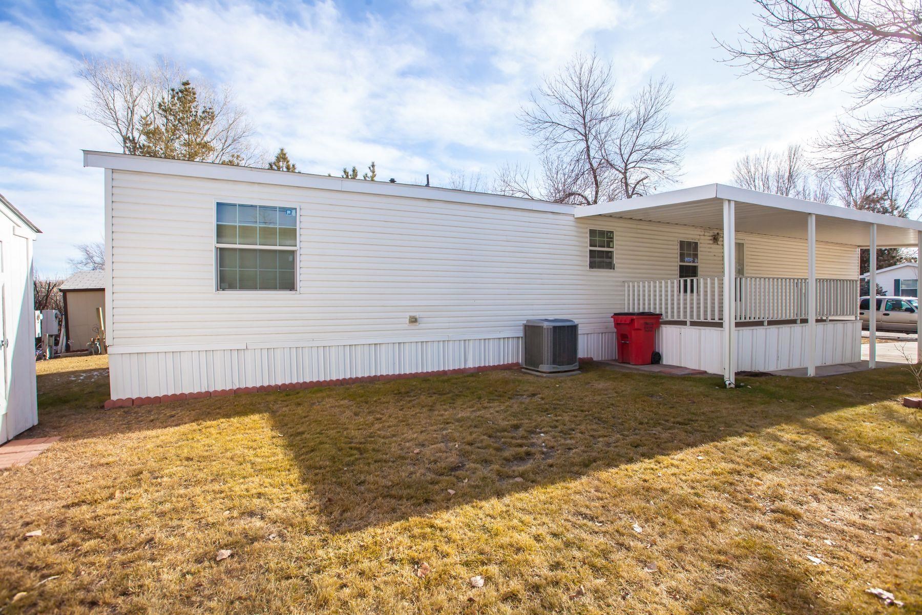 435 32 Road, Unit 232 Clifton, CO 81520 - Photo 6 of 37 a view of a house with a yard and garage