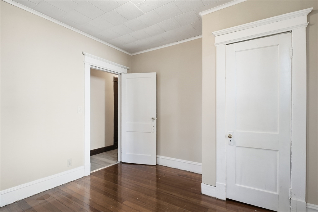51-53 Abbe Avenue Springfield, MA 01107 - Photo 17 of 42 an empty room with wooden floor & closet