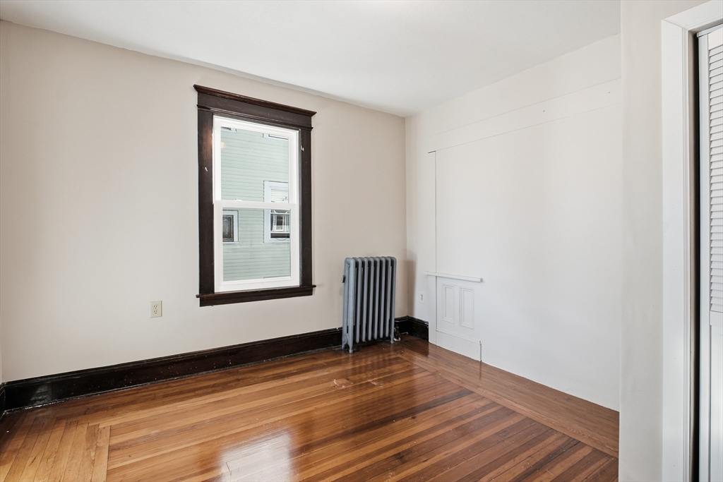 51-53 Abbe Avenue Springfield, MA 01107 - Photo 30 of 42 a view of empty room with wooden floor and fan