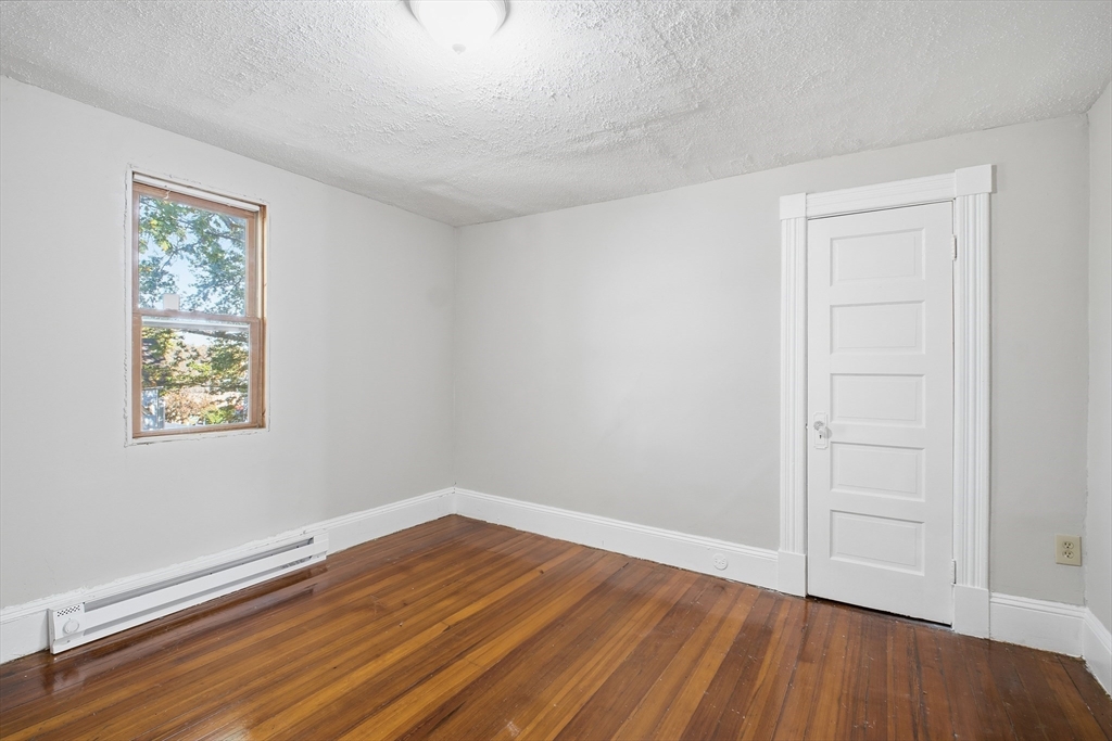 51-53 Abbe Avenue Springfield, MA 01107 - Photo 38 of 42 wooden floor in an empty room