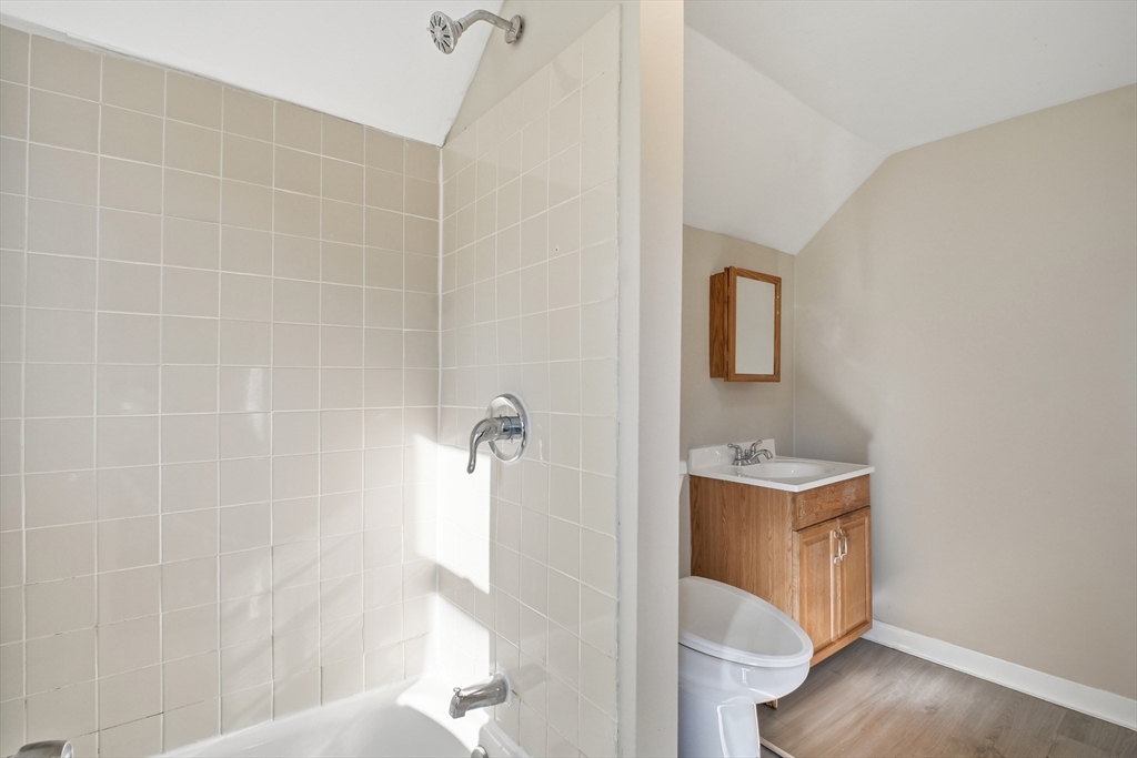 51-53 Abbe Avenue Springfield, MA 01107 - Photo 40 of 42 a bathroom with a bathtub a sink and mirror