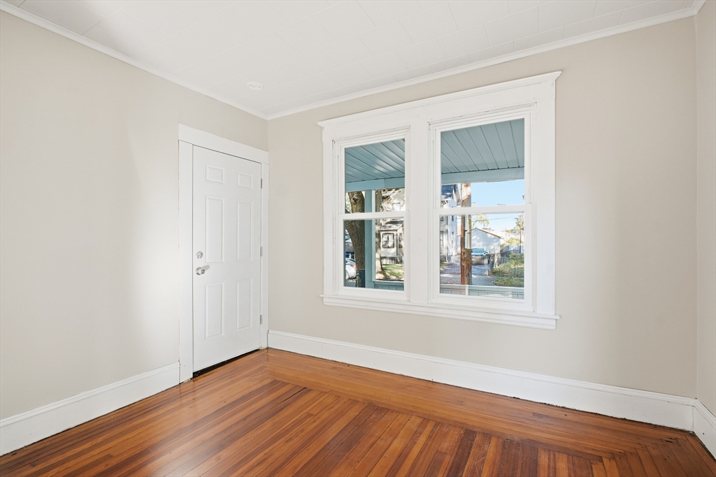 51-53 Abbe Avenue Springfield, MA 01107 - Photo 6 of 42 an empty room with wooden floor and windows