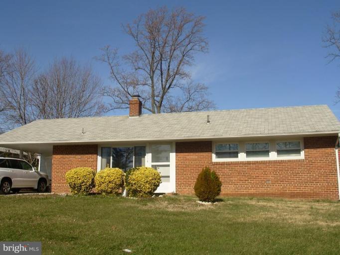 6716 Edsall Road Springfield, VA 22151 - Photo 1 of 17 a front view of a house with a garden