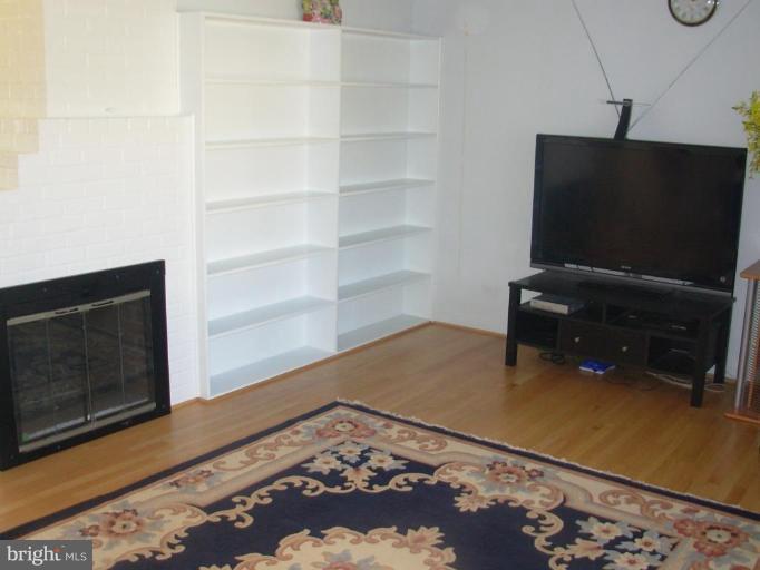 6716 Edsall Road Springfield, VA 22151 - Photo 4 of 17 a room with a flat screen tv and a rug
