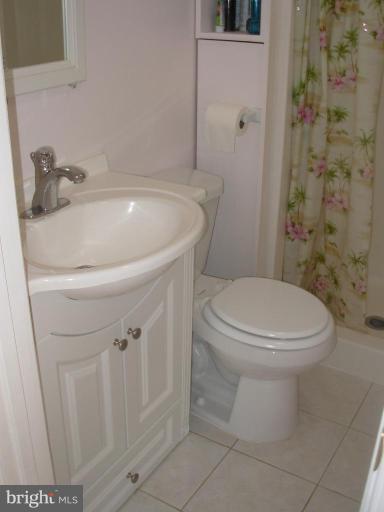 6716 Edsall Road Springfield, VA 22151 - Photo 6 of 17 a white toilet sitting next to a bathroom sink