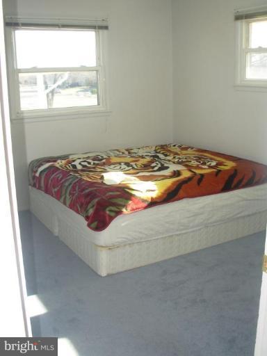 6716 Edsall Road Springfield, VA 22151 - Photo 9 of 17 a bedroom with a bed and window