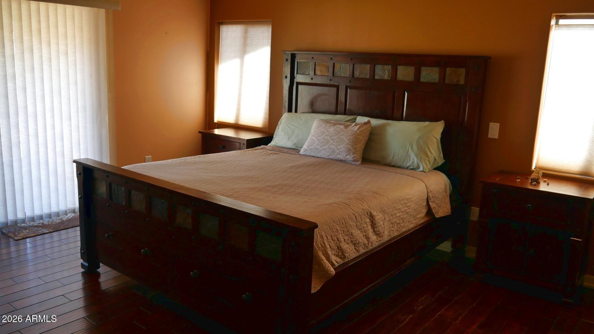 60 Rio Verde Circle Sedona, AZ 86351 - Photo 12 of 28 a bed sitting in a bedroom next to a window with lamp