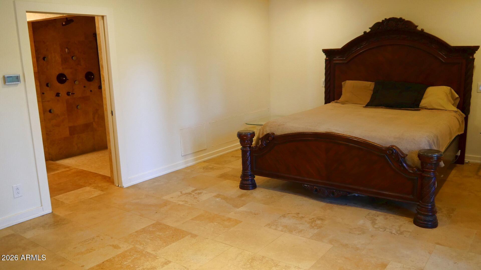 60 Rio Verde Circle Sedona, AZ 86351 - Photo 25 of 28 a bedroom with a bed and a painting on the wall