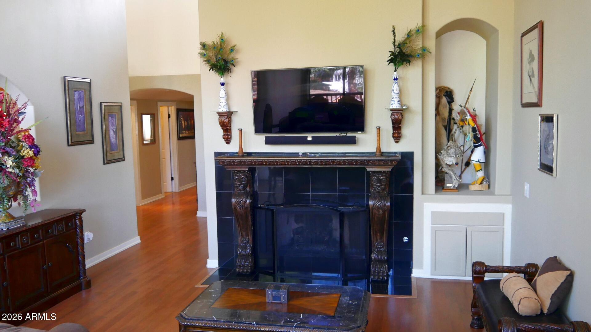 60 Rio Verde Circle Sedona, AZ 86351 - Photo 6 of 28 a living room with furniture a flat screen tv and a fireplace