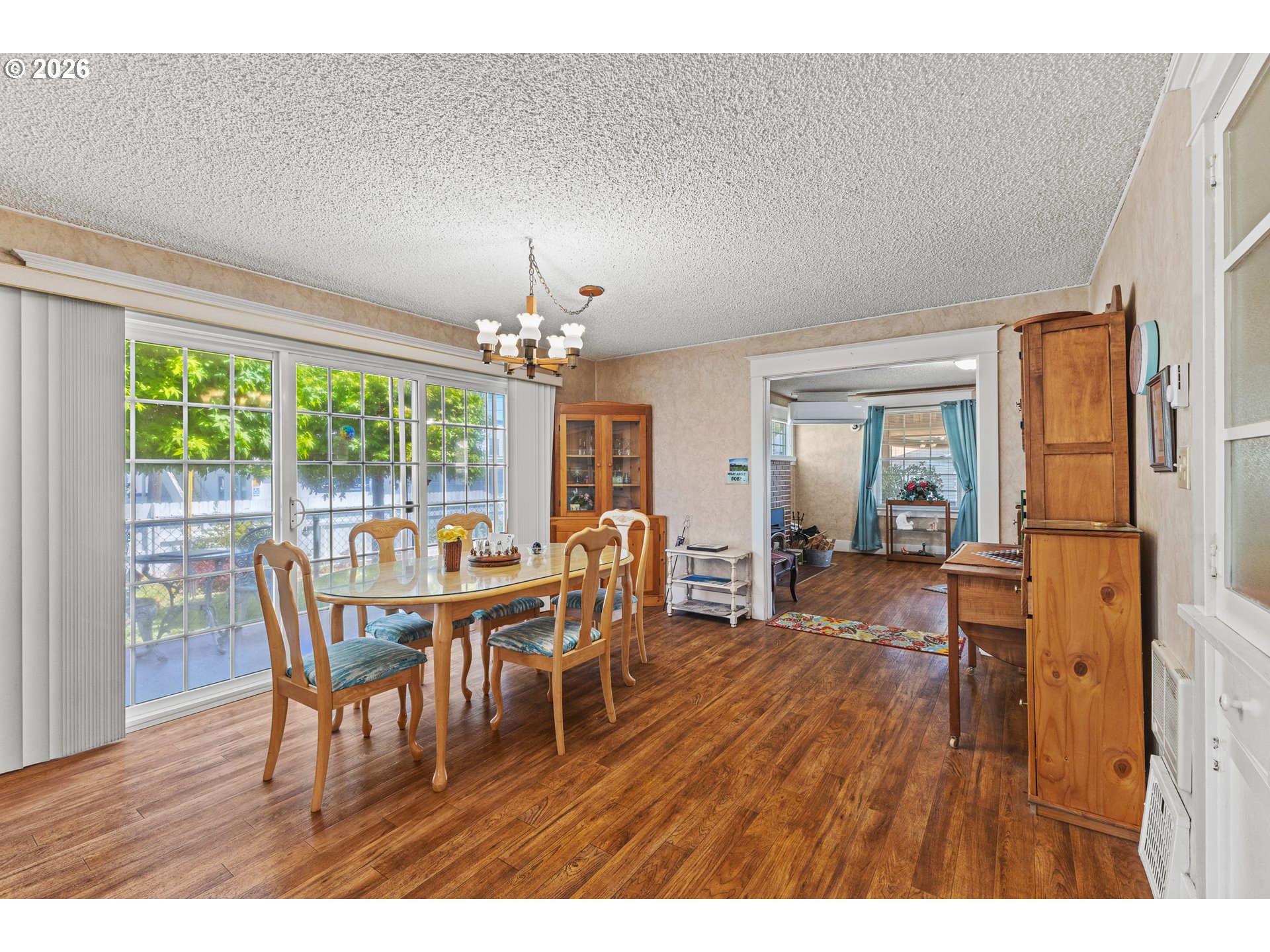 208 7th Street Myrtle Point, OR 97458 - Photo 23 of 48 a view of a dining room with furniture wooden floor and chandelier