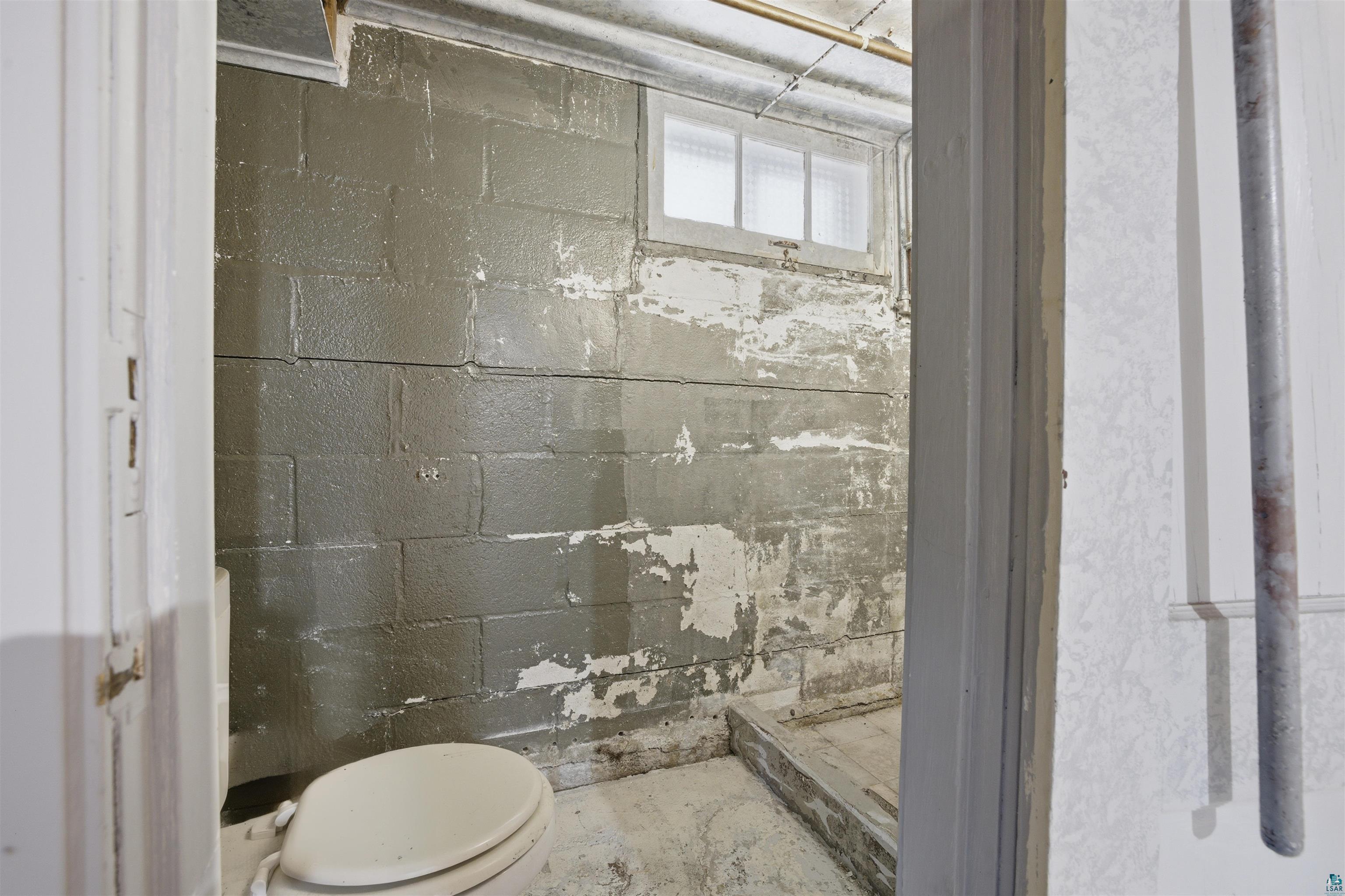 726 Summit Street Eveleth, MN 55734 - Photo 20 of 29 Full bathroom with a stall shower and concrete flooring