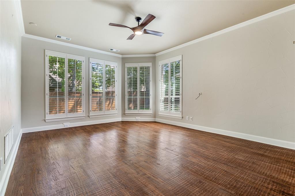 901 Sandy Trail Keller, TX 76248 - Photo 21 of 36 Unfurnished room with a ceiling fan, crown molding, and dark wood finished floors