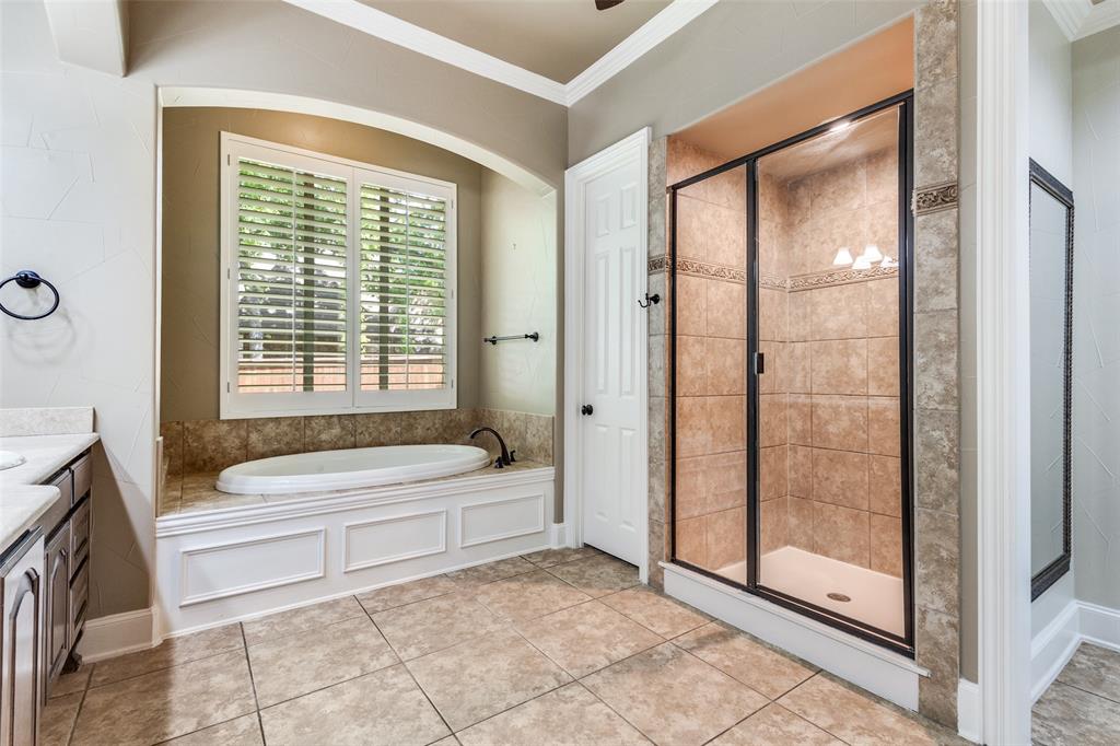 901 Sandy Trail Keller, TX 76248 - Photo 23 of 36 Full bath featuring ornamental molding, a stall shower, a bath, vanity, and light tile patterned flooring