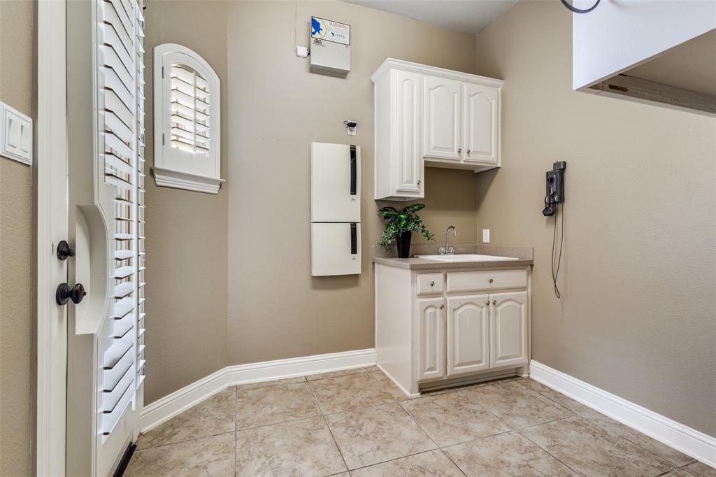 901 Sandy Trail Keller, TX 76248 - Photo 33 of 36 Laundry area featuring light tile patterned floors and baseboards