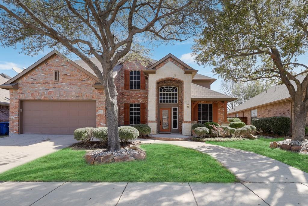 3116 Timber Ridge Trail McKinney, TX 75071 - Photo 1 of 1 a front view of a house with garden