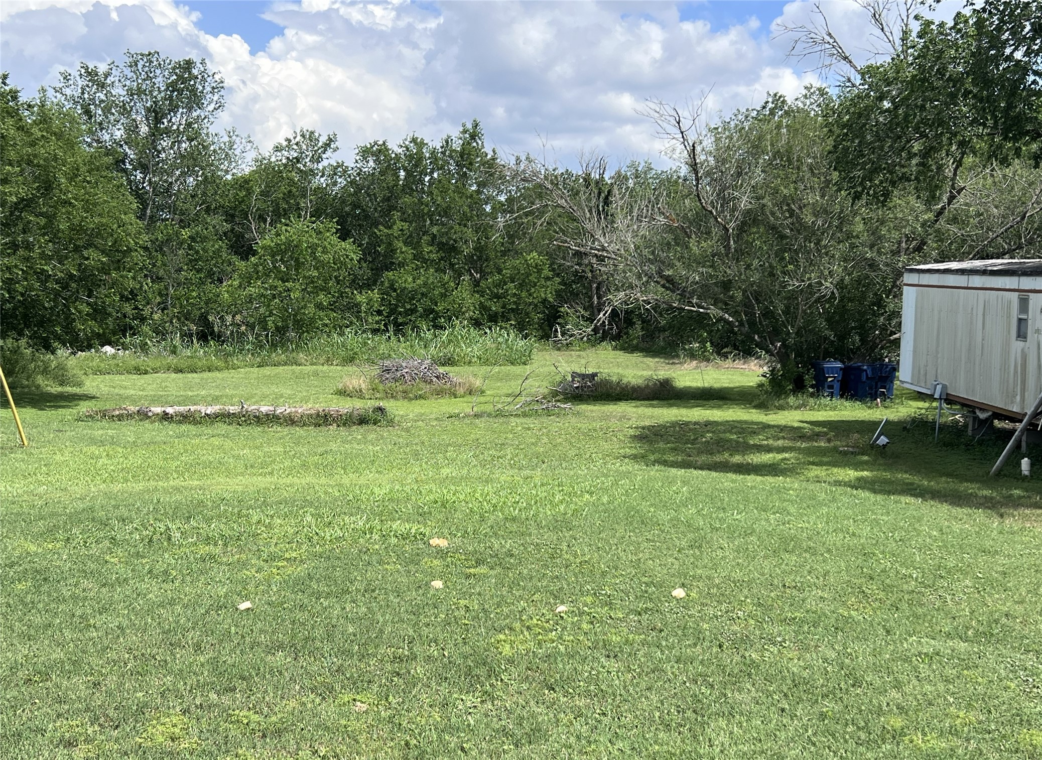 10001 Peterson Road Del Valle, TX 78617 - Photo 23 of 29 a view of outdoor space with deck and yard
