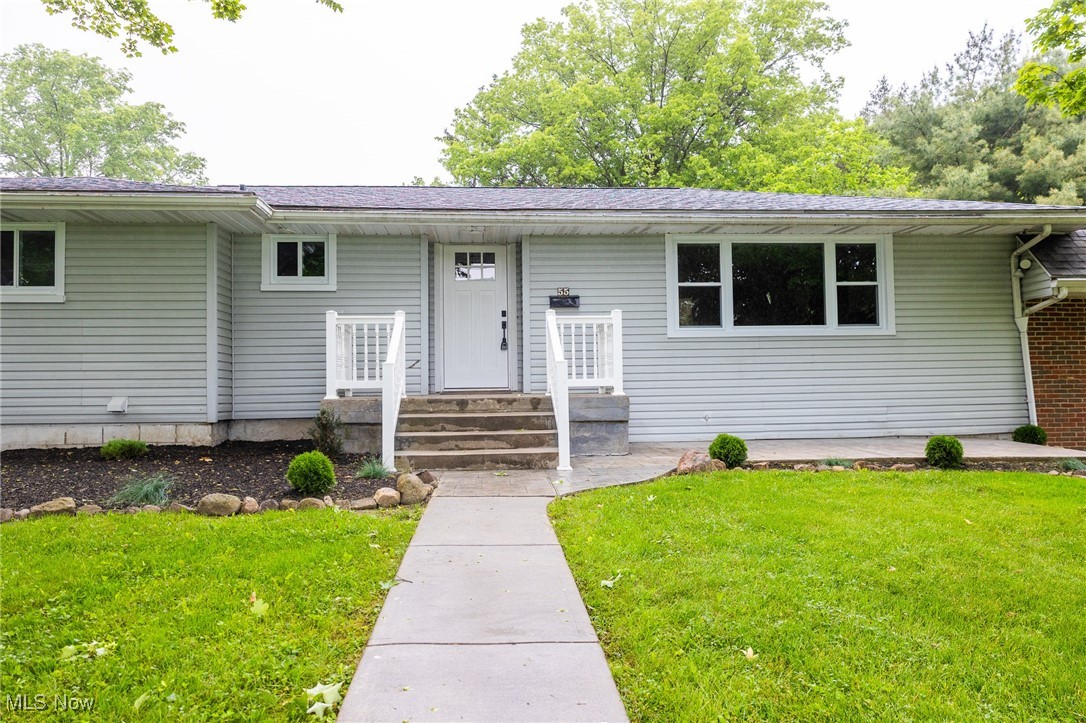 55 Elm Street Rittman, OH 44270 - Photo 4 of 46 View of front facade with a front lawn