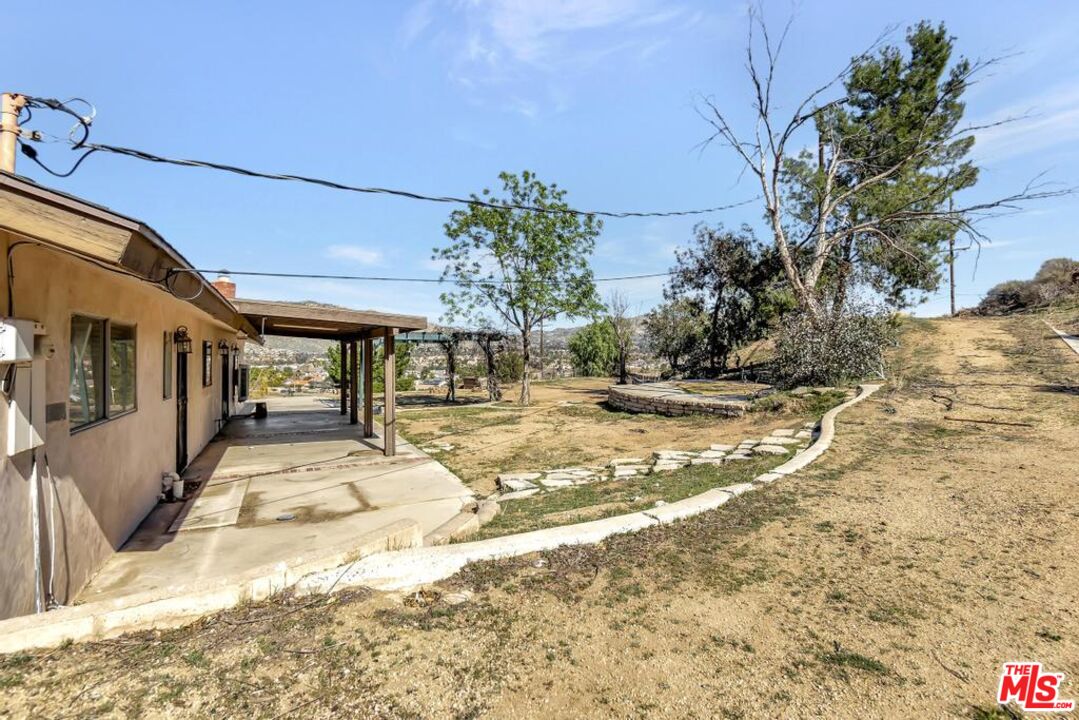 11455 Pigeon Pass Road Moreno Valley, CA 92557 - Photo 21 of 48 a view of a patio with wooden fence