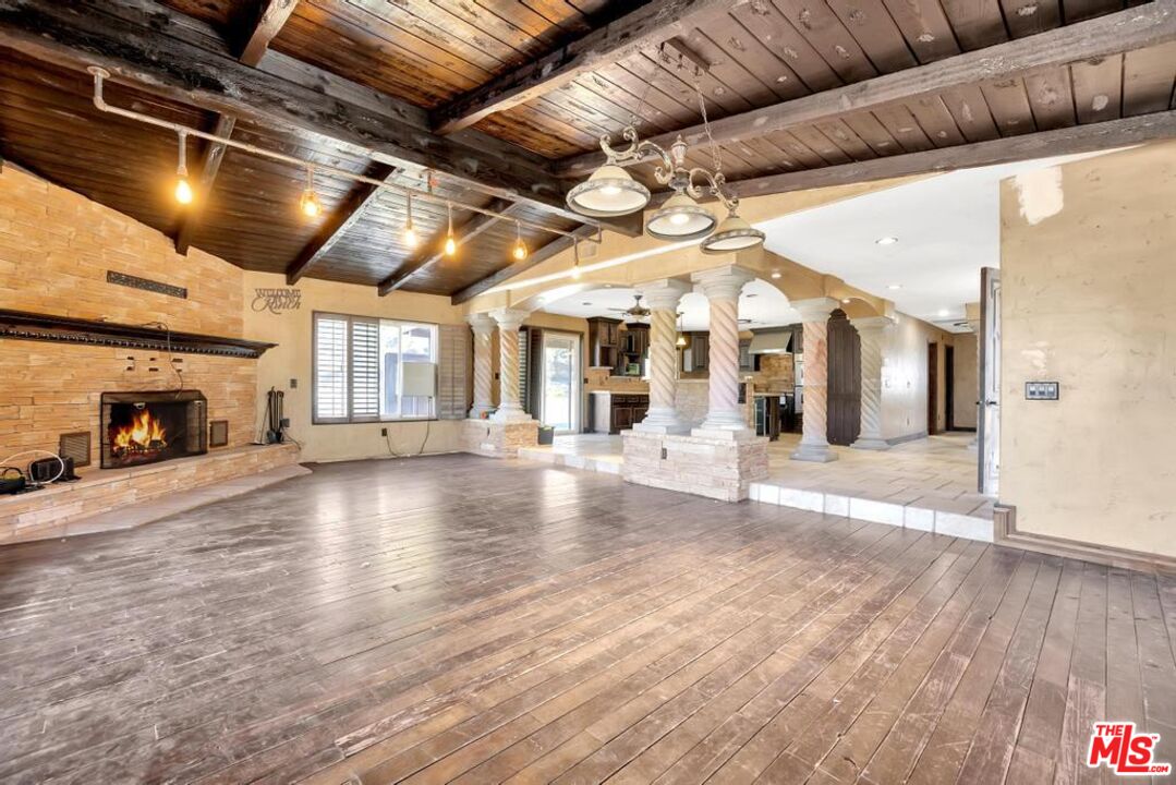 11455 Pigeon Pass Road Moreno Valley, CA 92557 - Photo 25 of 48 a view of a hall with wooden floor