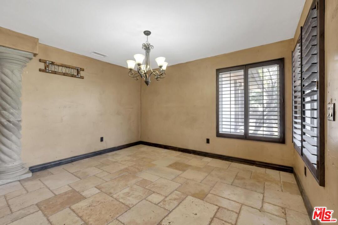 11455 Pigeon Pass Road Moreno Valley, CA 92557 - Photo 32 of 48 a view of an empty room with a window