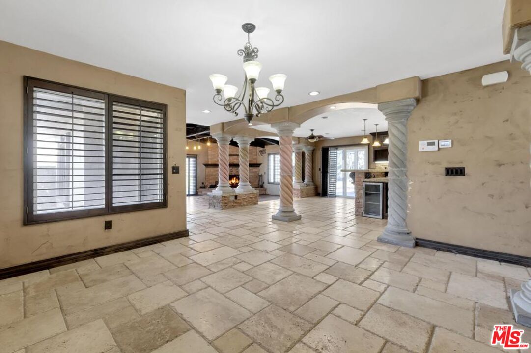 11455 Pigeon Pass Road Moreno Valley, CA 92557 - Photo 33 of 48 a view of entryway with a window and chandelier