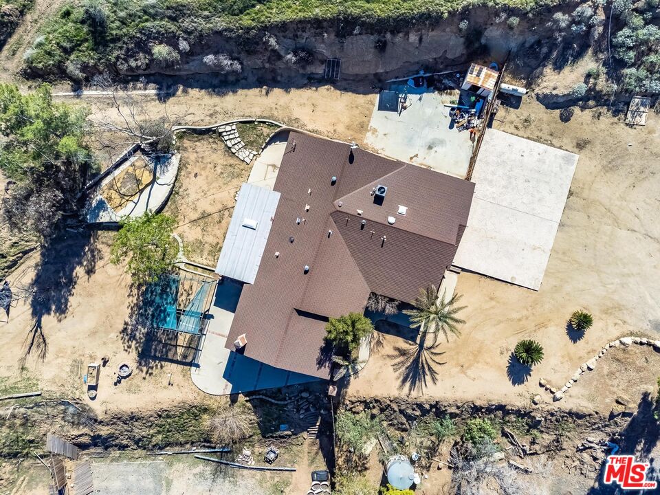 11455 Pigeon Pass Road Moreno Valley, CA 92557 - Photo 34 of 48 an aerial view of a house with a yard and sitting area