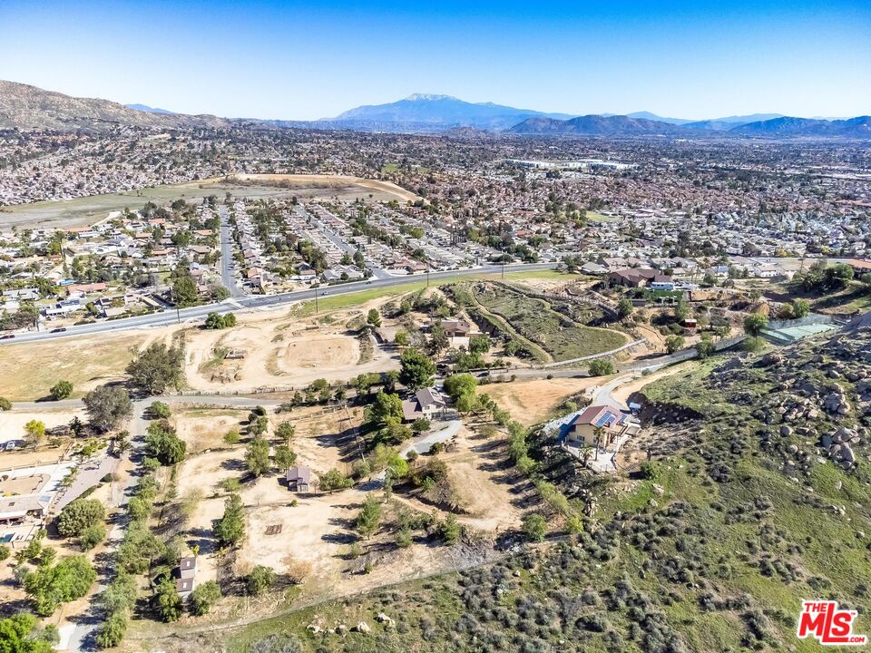 11455 Pigeon Pass Road Moreno Valley, CA 92557 - Photo 44 of 48 an aerial view of residential house and car parked