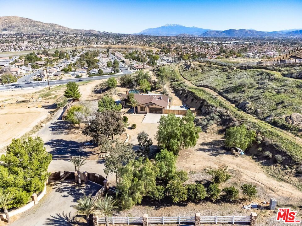 11455 Pigeon Pass Road Moreno Valley, CA 92557 - Photo 47 of 48 an aerial view of residential houses with outdoor space and trees