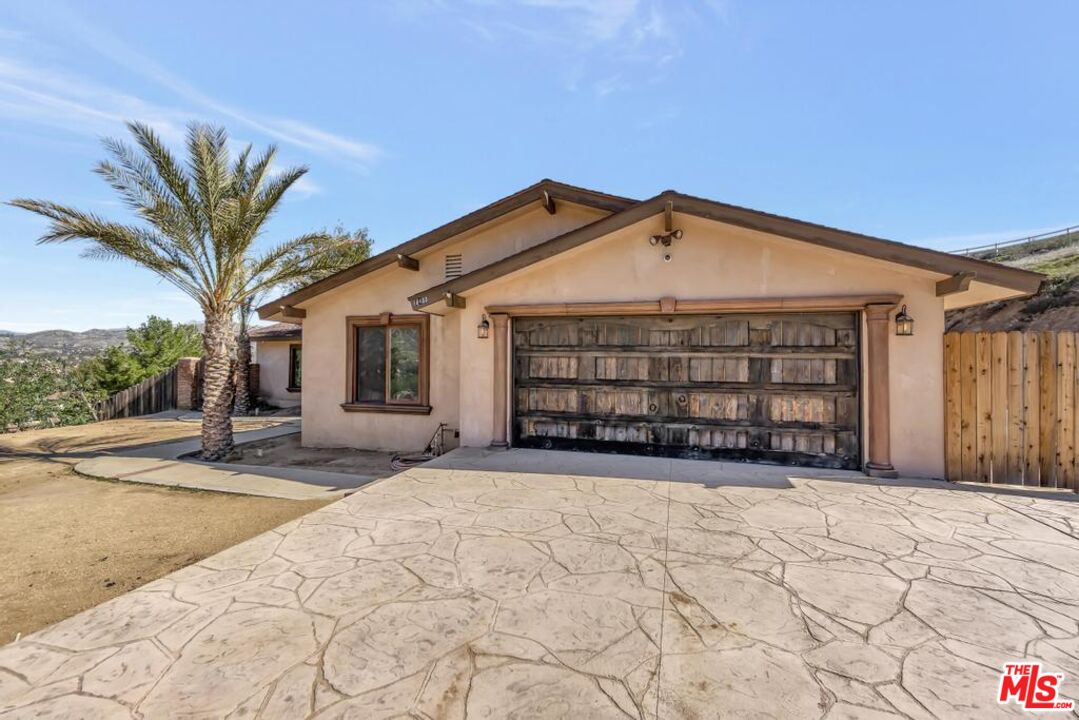11455 Pigeon Pass Road Moreno Valley, CA 92557 - Photo 5 of 48 a view of a house with a patio and a yard