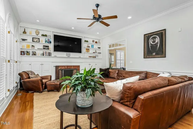 a living room with furniture fireplace and a flat screen tv