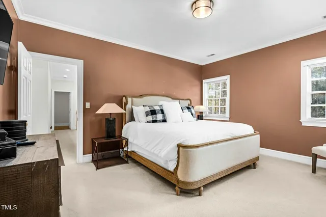 a bedroom with a bed and chair