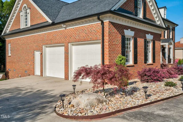 a view of a roof deck with table and chairs under an umbrella