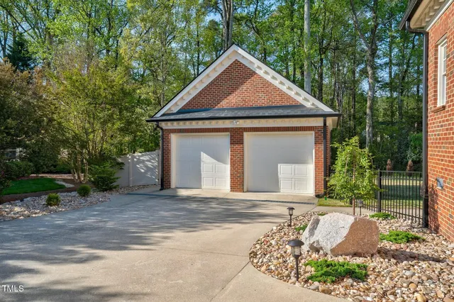 a view of entertaining space with trees and barbeque oven