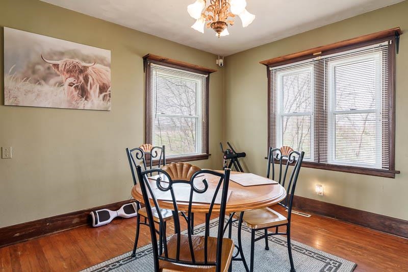 16905 West State Road Pecatonica, IL 61063 - Photo 11 of 47 a view of a dining room with furniture window and wooden floor