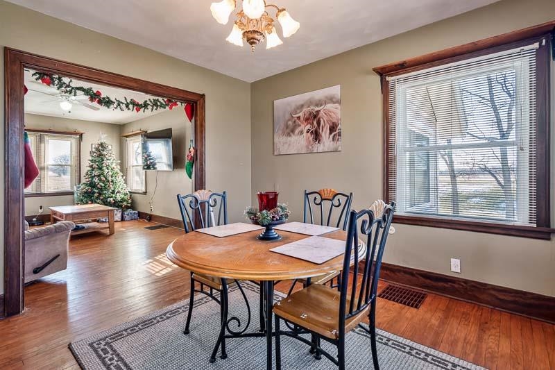 16905 West State Road Pecatonica, IL 61063 - Photo 11 of 36 a view of a dining room with furniture window and wooden floor