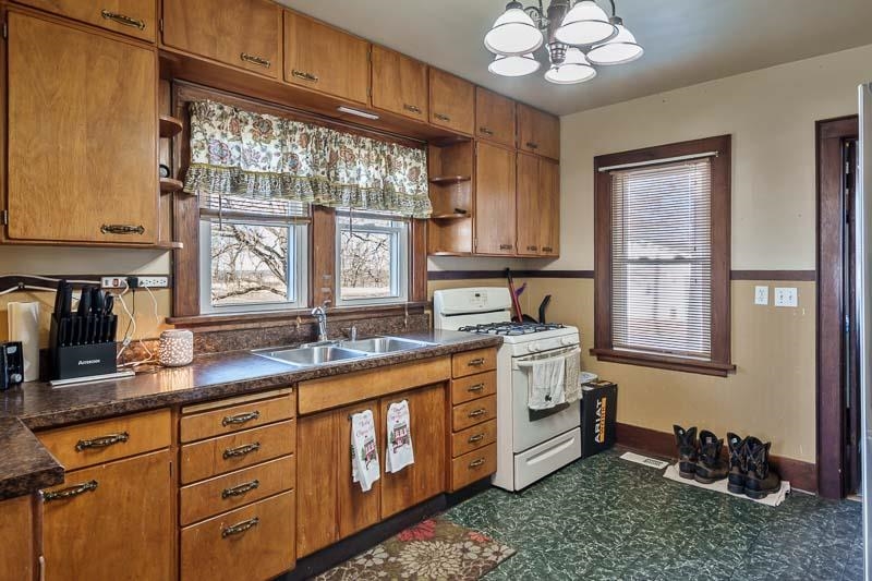 16905 West State Road Pecatonica, IL 61063 - Photo 13 of 36 a kitchen with a sink cabinets and window